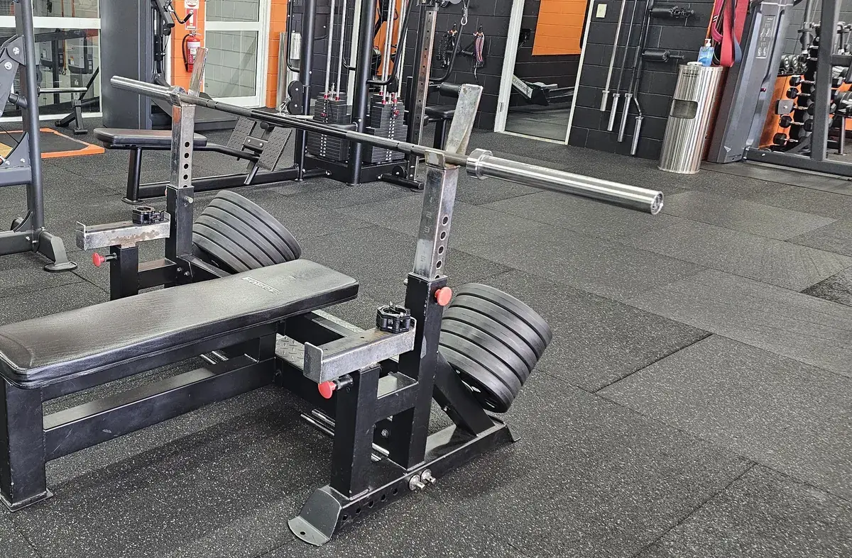A loaded flat bench press station on the rubber floor at Get Fit Burdekin