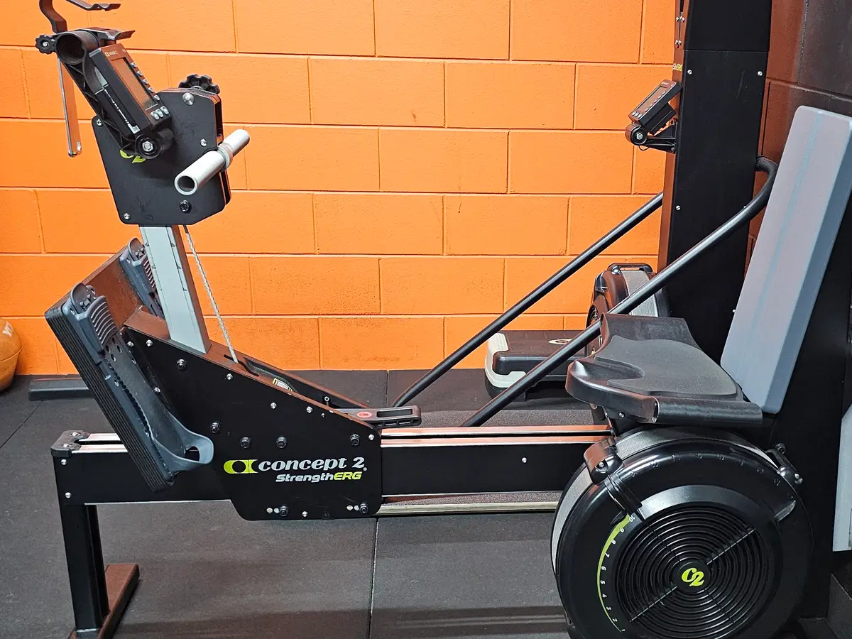 A Concept2 StrengthERG against the orange brick wall at Get Fit Burdekin